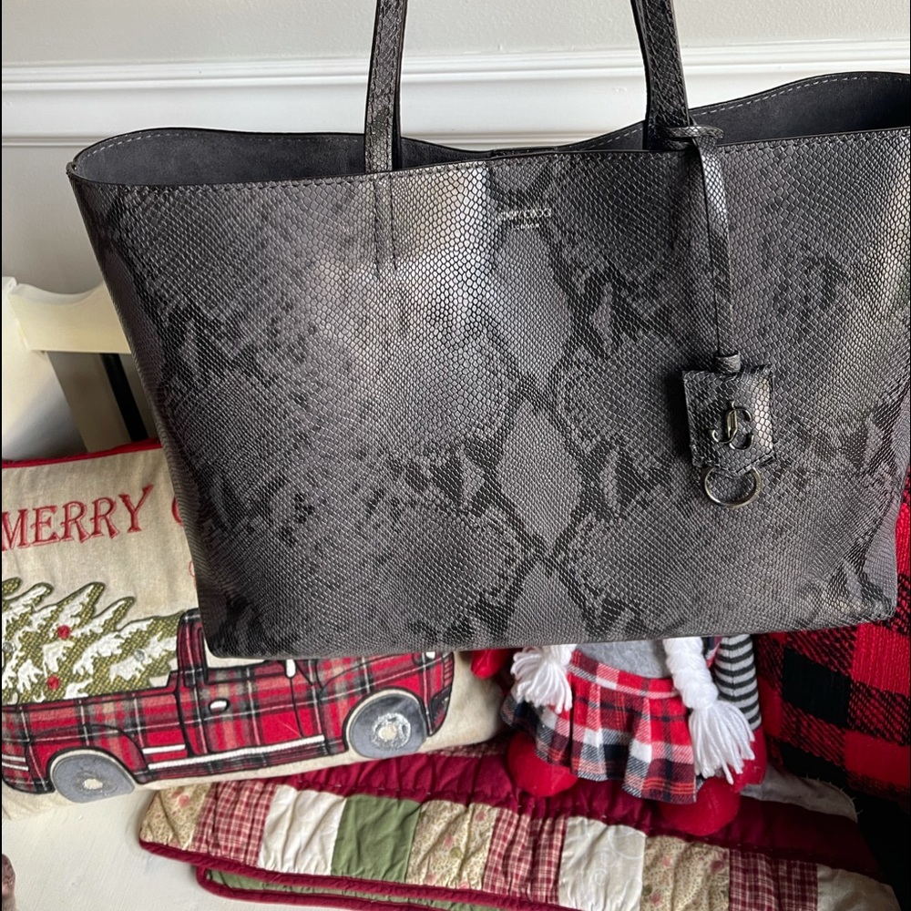 For sale a Jimmy Choo tote in perfect condition! Hardly used beautiful bag!